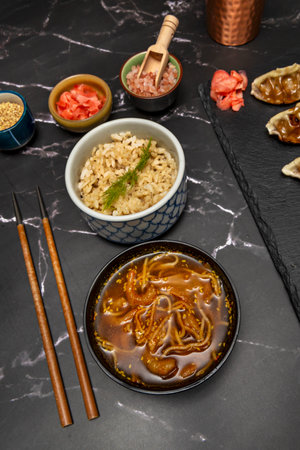 Ramen noodles with shrimp, marinated egg, sweetcorn, and narutomakiの写真素材