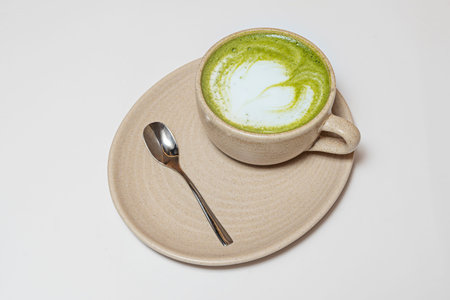 Mocha with melted chocolate, steamed milk, and whipped cream in a transparent cup that reveals the...
