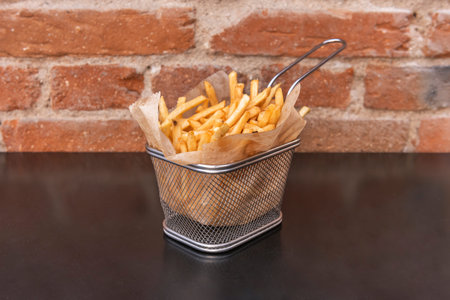 The steam still visible above the freshly served fries suggests their ideal temperature, while salt...