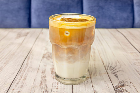 Hazelnut iced latte with medium-roast coffee beans, oat milk, and natural hazelnut syrup, garnished...