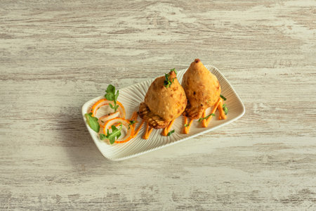 Golden triangles of pure delight, fresh from the oil and filled with a fragrant mixture of potatoes,...