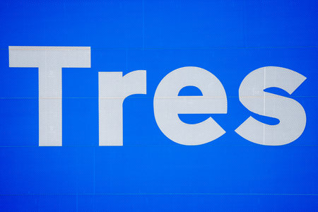 a blue surface with the word three written on itの写真素材