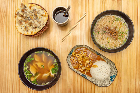Traditional Shoyu Ramen with clear chicken broth, handmade noodles, narutomaki, menma, and freshly...