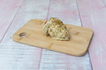 Handmade croissant with perfectly visible layers of rolled butter and a uniform golden brown,...
