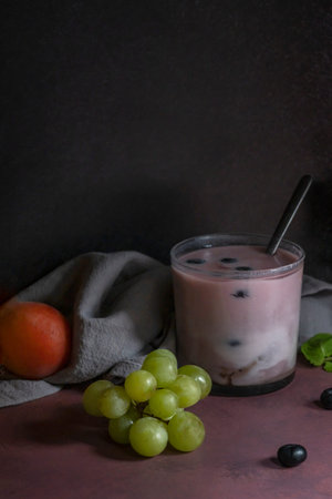 A minimalist still life with visual impact: three key elementsâ€”a deep bowl filled with dark...