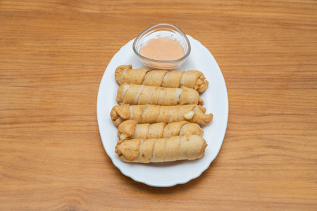 The golden embrace of the dough: an intimate close-up of the process of wrapping the puff pastry...