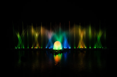 The musical fountain with a black background.の写真素材