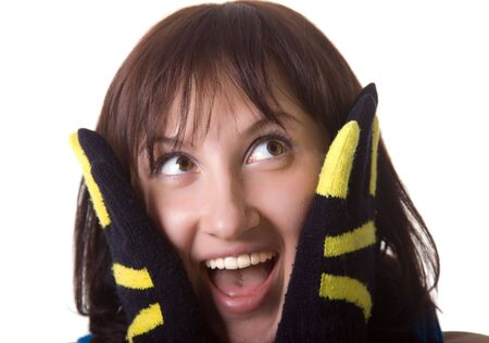 The lady in black-yellow gloves looks upwards and shouts. Isolated.の写真素材