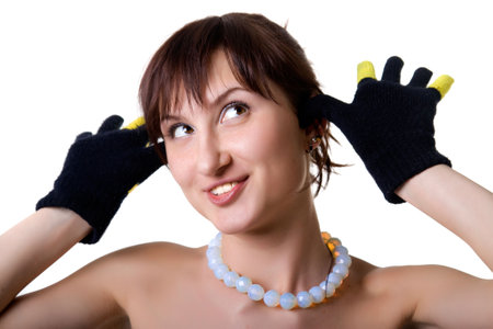 The beautiful woman in gloves shows gesture and looks upwards. Isolated on white.の写真素材