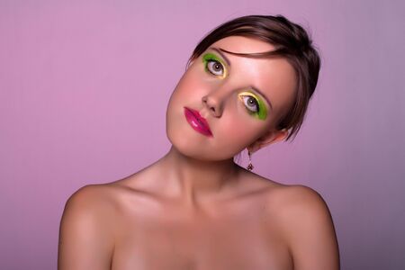 Sexual russian lady. Green-yellow make-up.の写真素材
