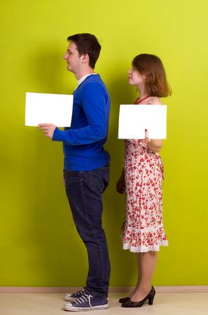 People holding a blank paper. On green background.の写真素材