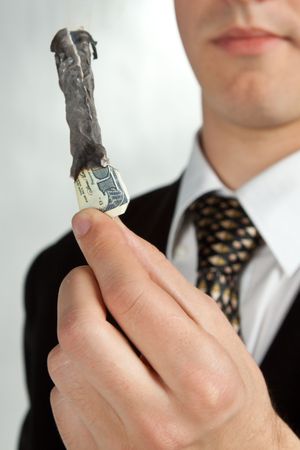 Burned 100 dollars. Bisiness concept.の写真素材