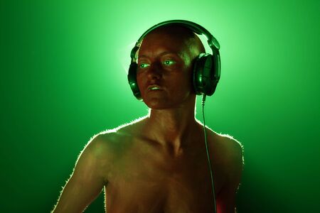 Girl in headphones. High textured skin.の写真素材