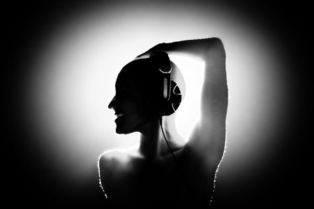 Girl in headphones. High textured skin.の写真素材