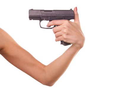 Woman's hand with a gun. Isolated on white.の写真素材