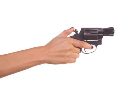 Woman's hand with a gun. Isolated on white.の写真素材