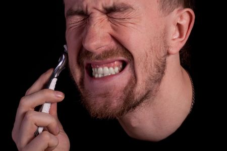Men shaving faces. Close-up. Macro.の写真素材