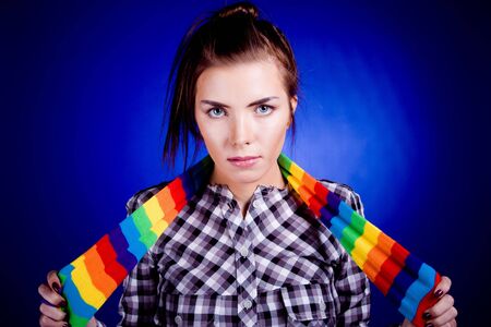 Woman portrait. On blue background.の写真素材