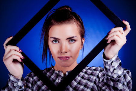 Woman portrait. On blue background.