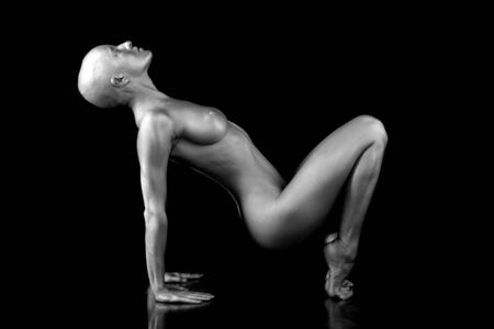 Beautiful bald woman. On black background.の写真素材