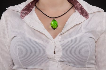 Amber Jewelry on female neck. Closeup.の写真素材