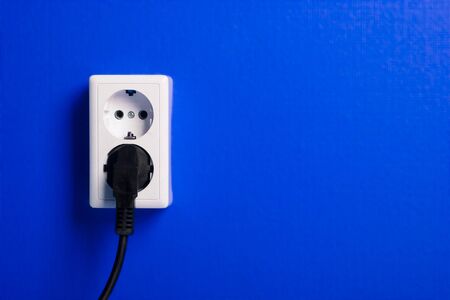 White electric socket on the wall. Close up.の写真素材