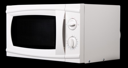 Microwave oven. On black background.の写真素材