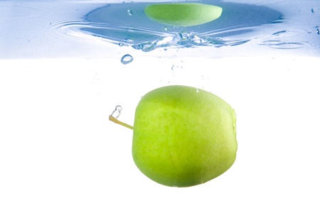 Apple fell into the water. Close-upの写真素材