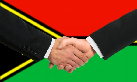 The Vanuatu flag and business handshakeの写真素材
