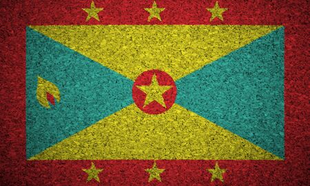 The Grenada flag painted on a cork board.の写真素材