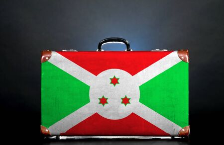 The Burundi flag on a suitcase for travel.の写真素材