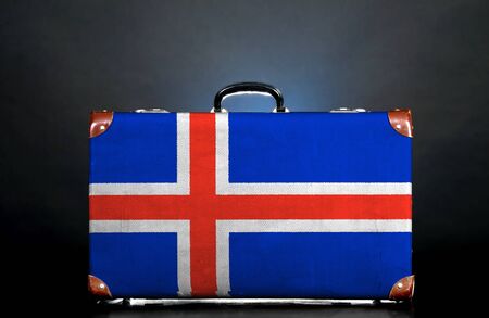 The Icelandic flag on a suitcase for travel.の写真素材