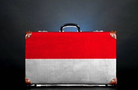 The Indonesian flag on a suitcase for travel.の写真素材