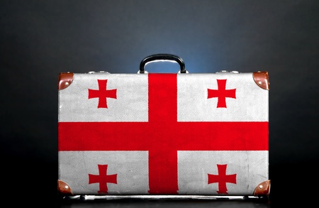 The Georgian flag on a suitcase for travel.の写真素材