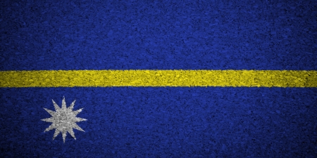 The Nauru flag painted on a cork board.の写真素材
