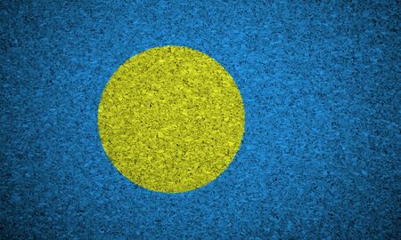 The Palau flag painted on a cork board.の写真素材