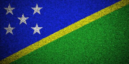 The Solomon Islands flag painted on a cork board.の写真素材