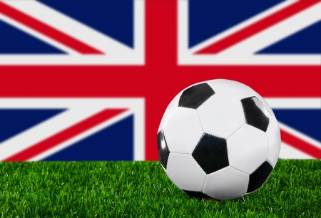The British flag and soccer ball on the green grass.の写真素材