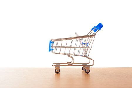 shopping carts on the wooden floor. isolated on whiteの写真素材