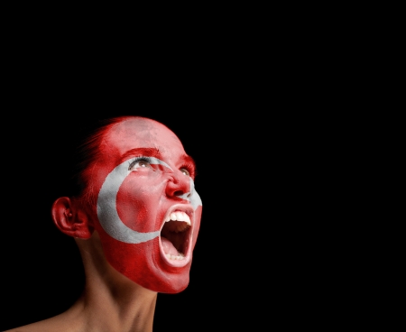 The Turkish flag on the face of a screaming woman  conceptの写真素材