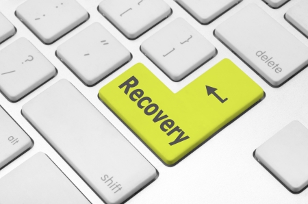 Business concept  Recovery key on the computer keyboardの写真素材