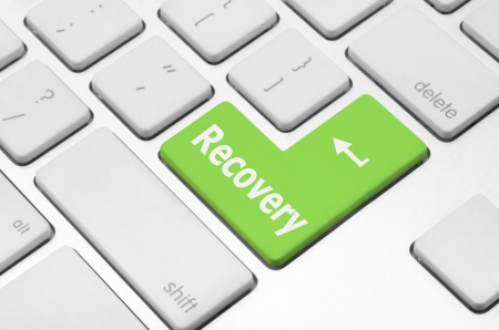 Business concept  Recovery key on the computer keyboardの写真素材