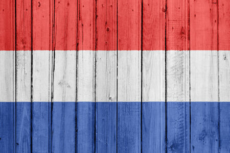 The Netherlands flag painted on a wooden fenceの写真素材