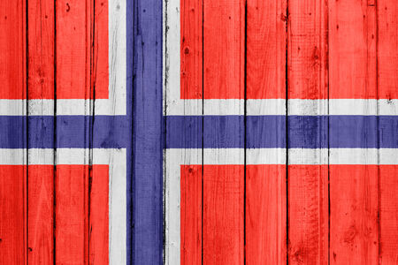 The Norwegian flag painted on a wooden fenceの写真素材