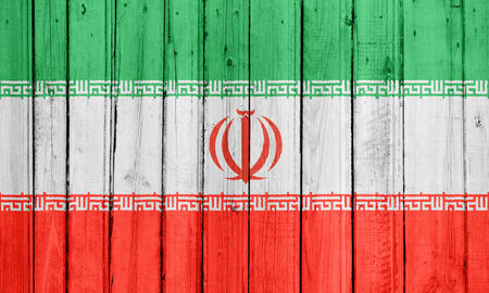 The Iranian flag painted on a wooden fenceの写真素材