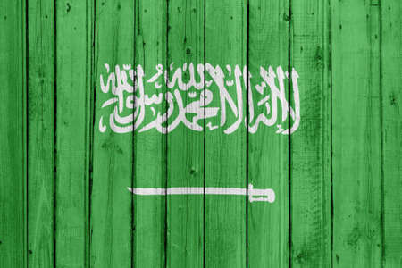 The Saudi Arabia flag painted on a wooden fenceの写真素材
