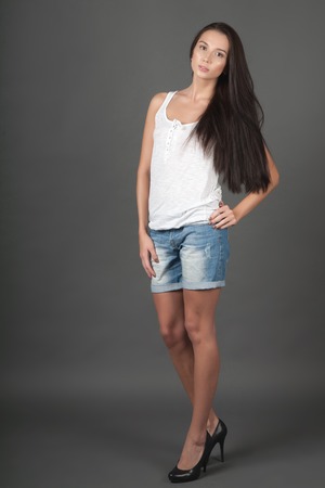 Portrait of a woman on gray backgroundの写真素材