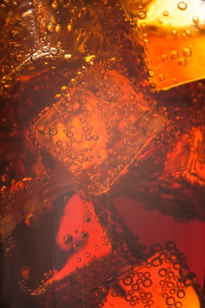 Close up view of the ice cubes in whiskey の写真素材