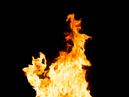 Fire flames - isolated on black background. Real photo