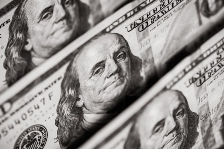 Hundred dollars bills standing in a rowの写真素材